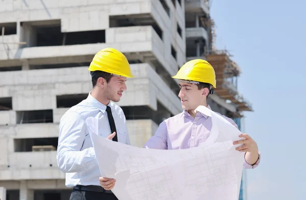 Team of architects on construciton site — Stock Photo, Image
