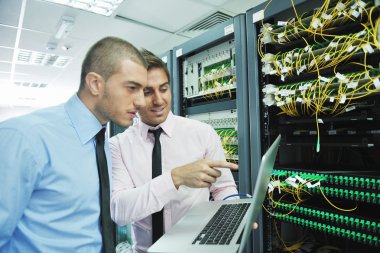 It engineers in network server room clipart