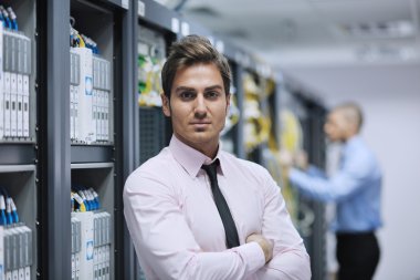 It engineers in network server room clipart
