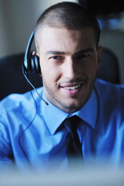 Üzletember fülhallgatóval — Stock Fotó