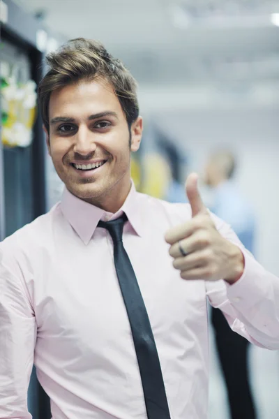 Young it engineer in datacenter server room — Stock Photo, Image