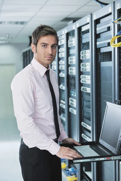 Young it engeneer in datacenter server room Royalty Free Stock Photos