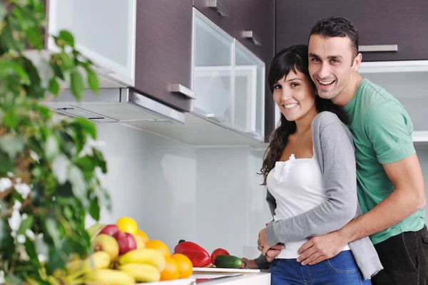 Young couple have fun in modern kitchen — Stock Photo, Image