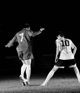 Football players in action for the ball