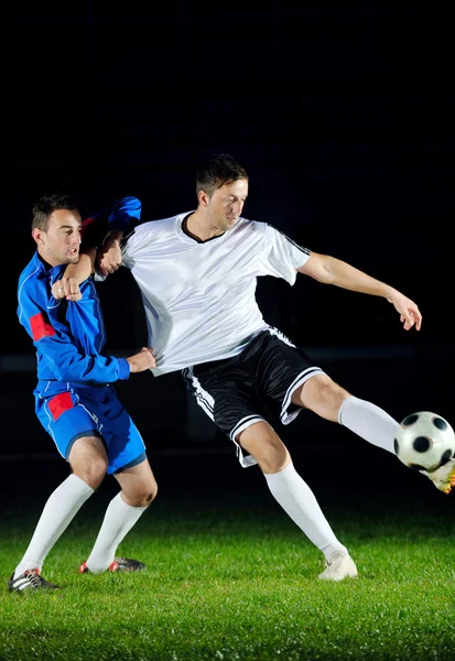 Football players in action for the ball — Stockfoto