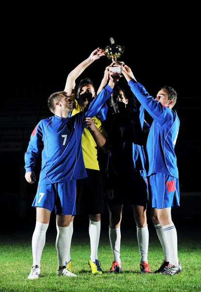Jogadores de futebol comemorando a vitória — Fotografia de Stock