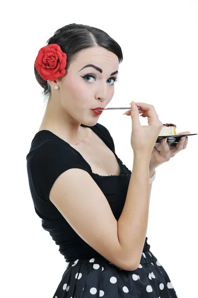 Gyönyörű fiatal nő enni édes sütemény — Stock Fotó