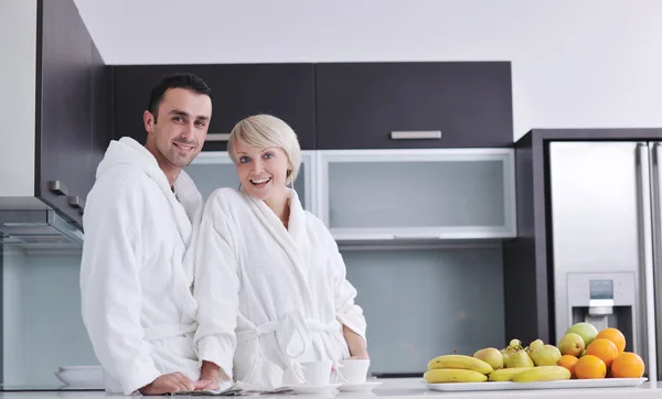 Young couple have fun in modern kitchen — Stock Photo, Image