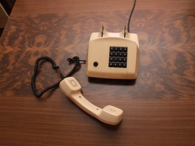 Old retro phone with a modern digital numpad clipart