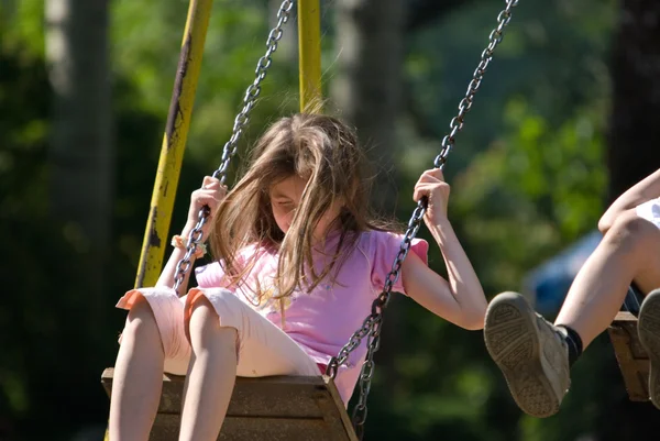 Happy girl swinging — Stock Photo, Image