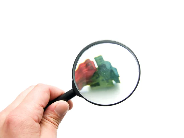 Hand with magnifying glass — Stock Photo, Image