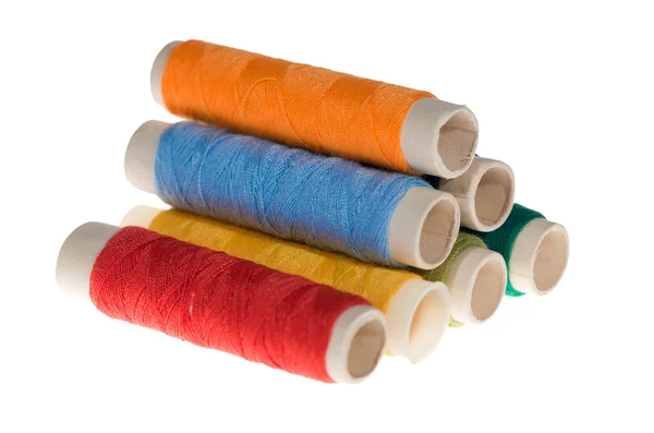 stock image Different color thread bobbins isolated on whit