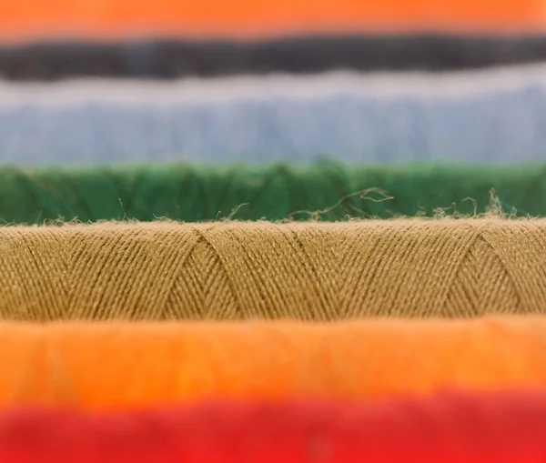 stock image Background with color thread bobbin