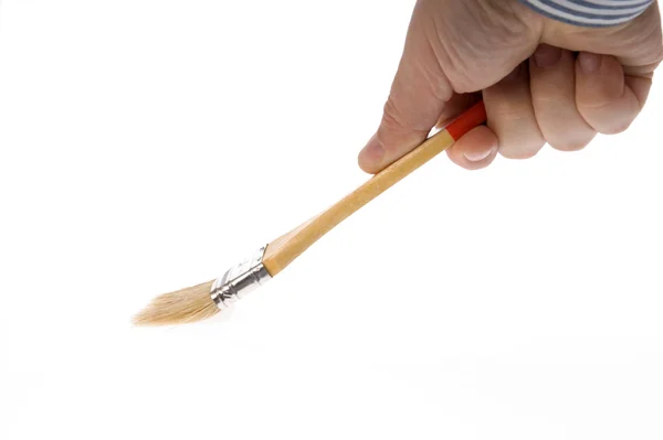 Isolated Clean paint brush in hand — Stock Photo, Image