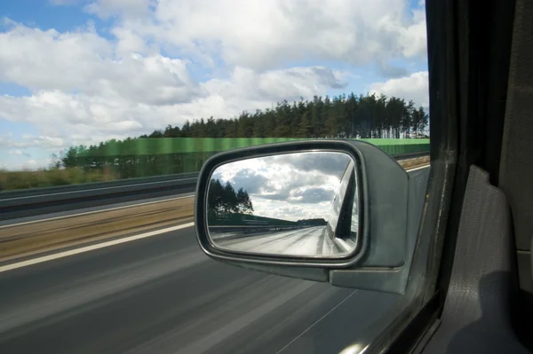 stock image Landscape in the mirror of a car