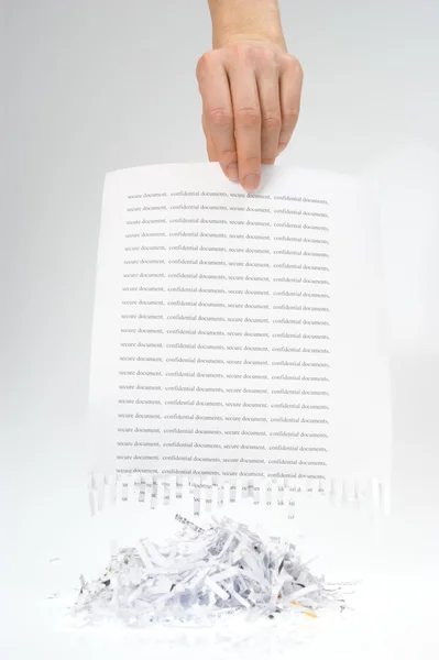 Papierschnipsel in der Hand — Stockfoto