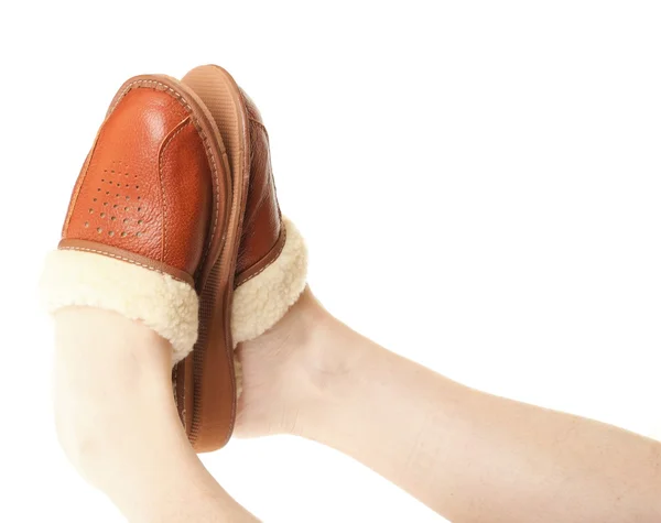 Brown slippers on the foot isolated — Stock Photo, Image