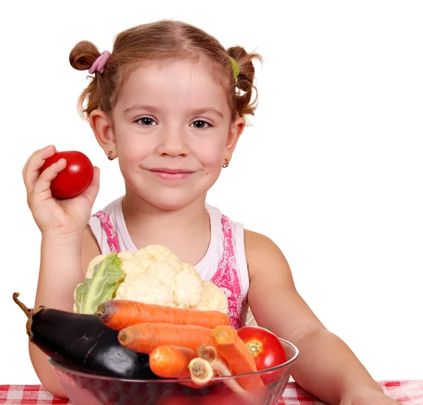 Liten flicka med grönsaker sunda matvanor — Stockfoto