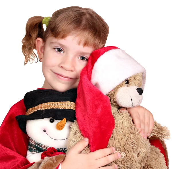 Маленька дівчинка тримає плюшевого ведмедика Санта Клауса — стокове фото