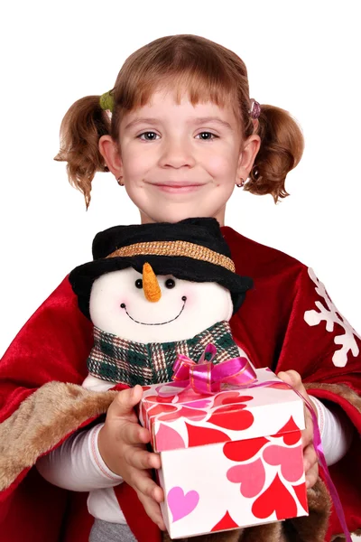 Little girl holding a Christmas present — Zdjęcie stockowe