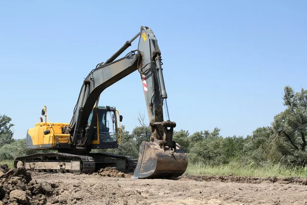 Excavator on road construction — Stock Photo, Image