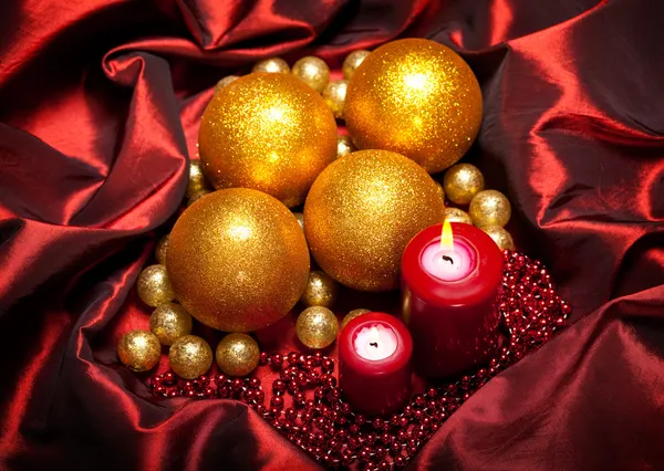 Christmas baubles and candles — Stock Photo, Image
