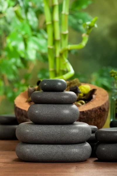 Spa massage - black stones — Stock Photo, Image