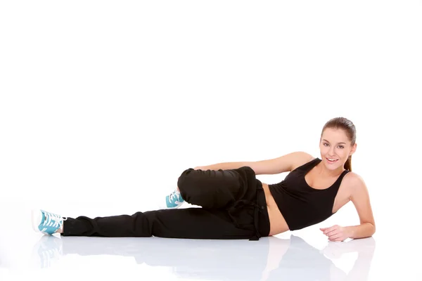 Hermosa mujer de fitness haciendo ejercicio de estiramiento — Foto de Stock