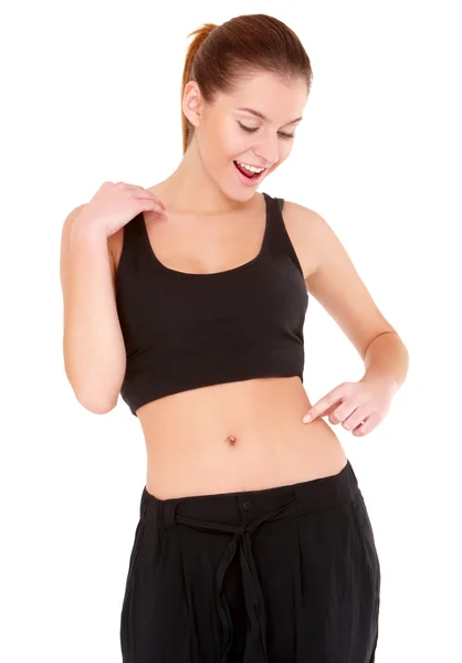 Mulher verifica a gordura da cintura no branco — Fotografia de Stock
