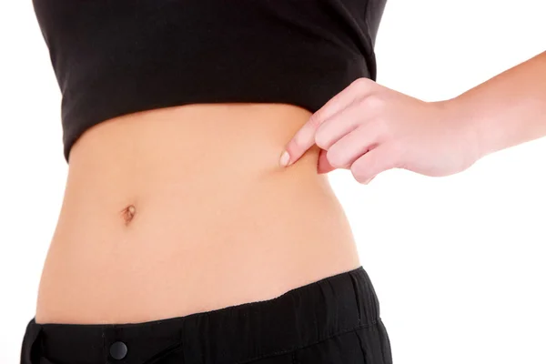 Mulher verifica a gordura da cintura — Fotografia de Stock