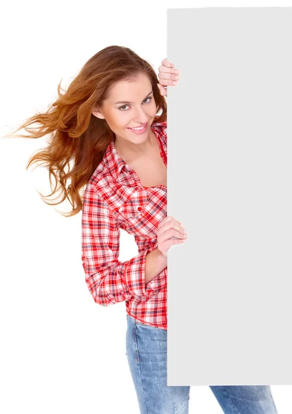 Lovely young woman in casual clothing holding empty board — Stock Photo, Image