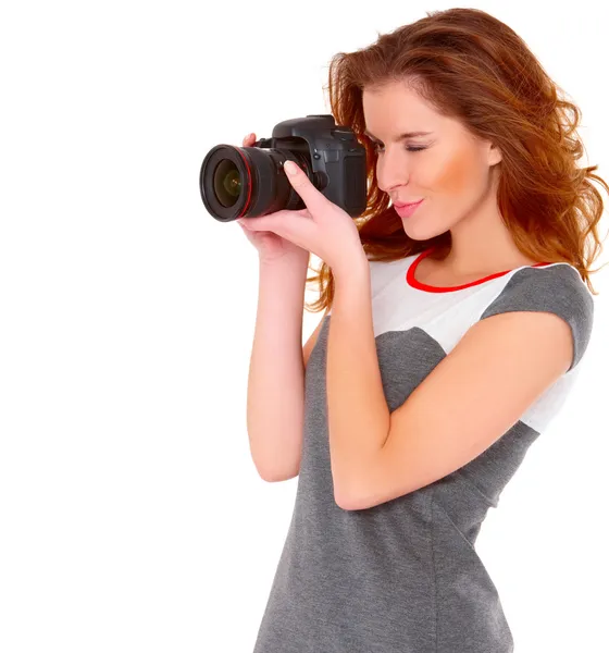 Woman in gray dress wit digtal camera on white — Stock Photo, Image