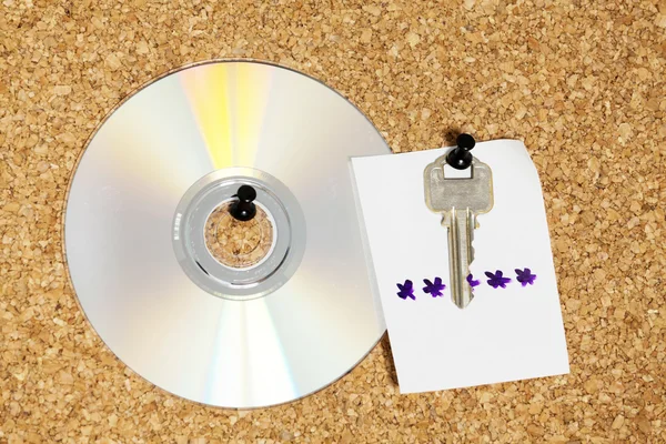 Key with note and CD — Stok fotoğraf