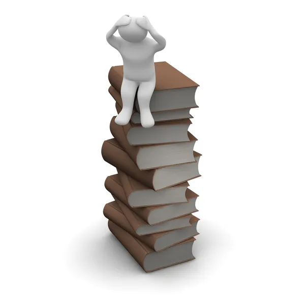 Frustrated man sitting on stack of books — Stockfoto