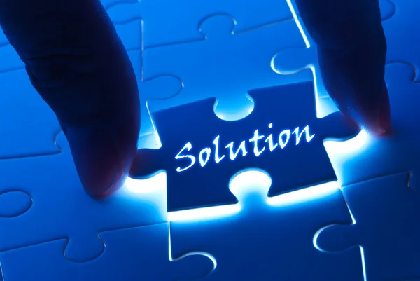 Solution word on puzzle piece — Stock Photo, Image