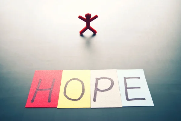 Parola di speranza colorata e persona singola — Foto Stock