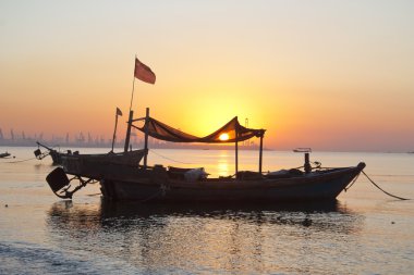 Fishing boat at dawn, clipart