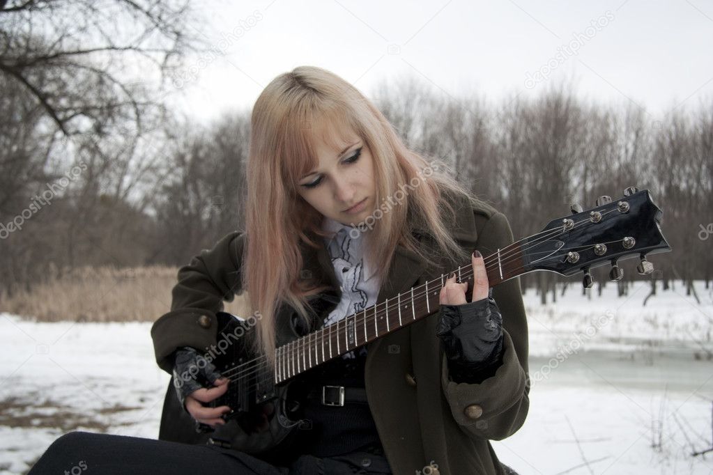 Girl plays guitar