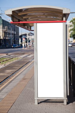 Bus stop with a blank billboard clipart