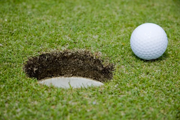 Çok bir delik golf topu — Stok fotoğraf
