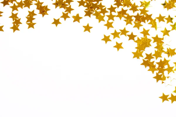 Weihnachtsdekoration aus goldenen Konfettisternen — Stockfoto