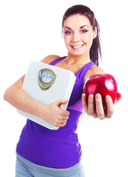 体重秤和苹果的女孩 — 图库照片