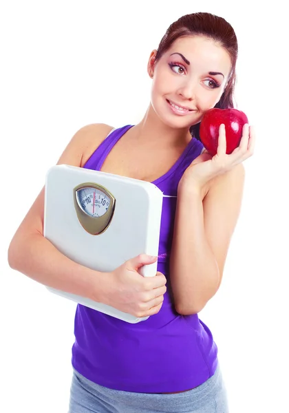Dziewczyna z wagi i jabłko — Zdjęcie stockowe