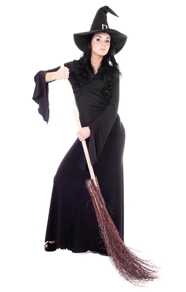 Witch with a broom Stock Photo
