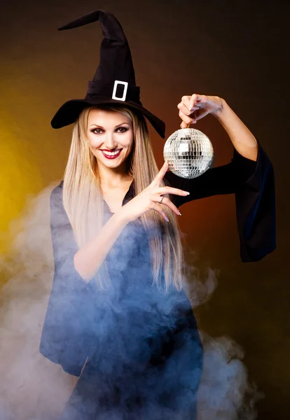 Witch with a disco ball — Stock Photo, Image