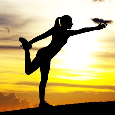 Woman practicing yoga clipart