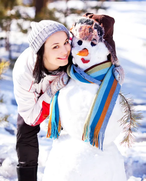 stock image Woman with a snowman