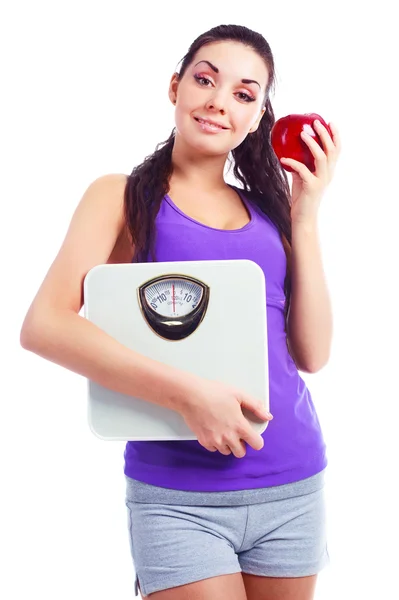 Kobieta z wagą i jabłko — Zdjęcie stockowe