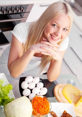 Woman in the kitchen clipart