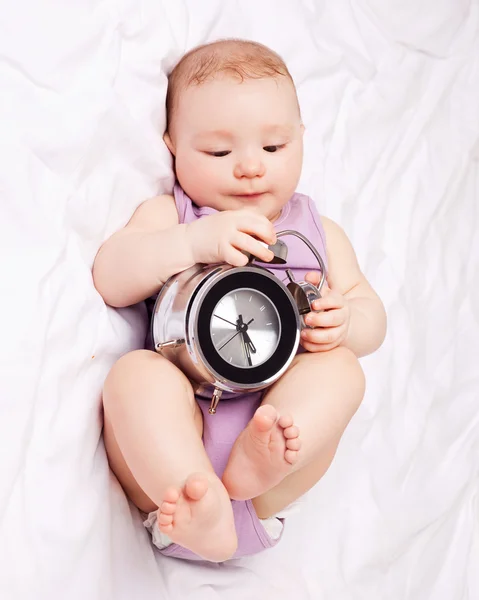 Baby with clock — Stock Photo, Image
